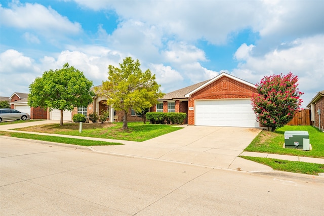 view of front of house with a front yard and a garage