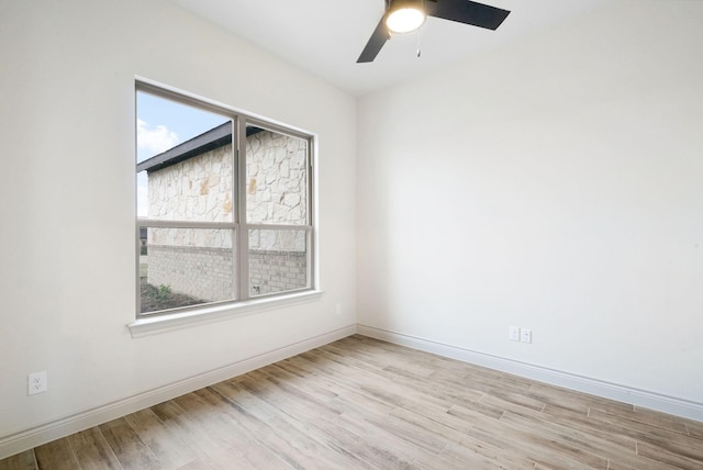 unfurnished room featuring light wood-type flooring and ceiling fan