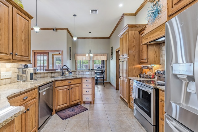 kitchen with crown molding, decorative light fixtures, sink, light stone countertops, and appliances with stainless steel finishes