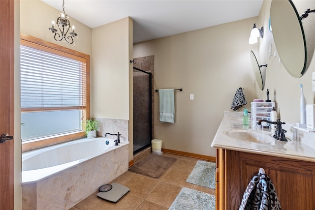 bathroom featuring vanity, a notable chandelier, tile patterned floors, and plus walk in shower