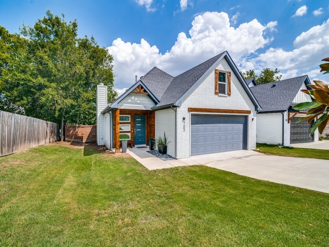 view of front of house with a garage and a front yard