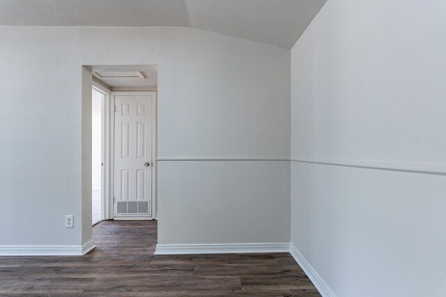 spare room with vaulted ceiling, ceiling fan, and dark hardwood / wood-style floors