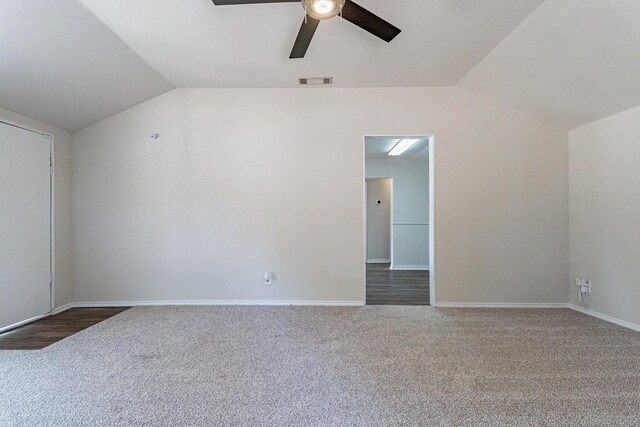 unfurnished room with light colored carpet, a wealth of natural light, and a textured ceiling