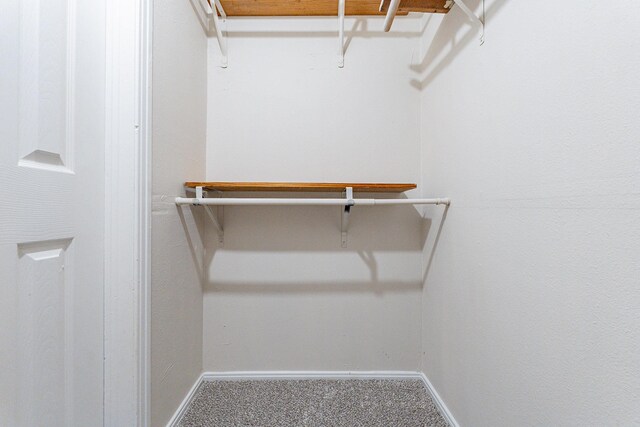 bathroom with tiled shower / bath combo, toilet, and a textured ceiling