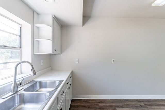 spare room with lofted ceiling and dark hardwood / wood-style floors