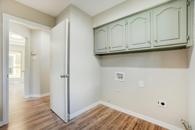 laundry room with wood-type flooring, hookup for a gas dryer, cabinets, washer hookup, and electric dryer hookup