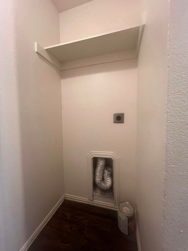 washroom with dark wood-type flooring and hookup for an electric dryer