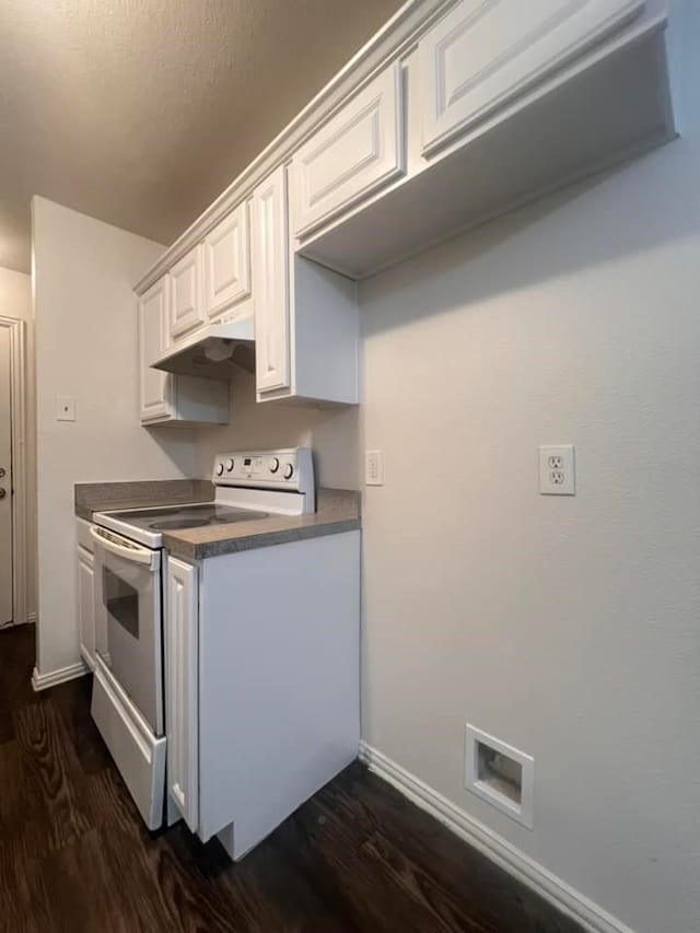 kitchen featuring white cabinets, dark wood-type flooring, and electric range