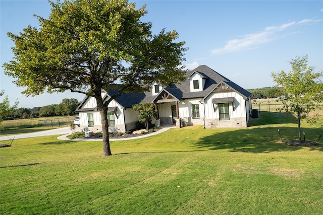 modern farmhouse featuring a front lawn