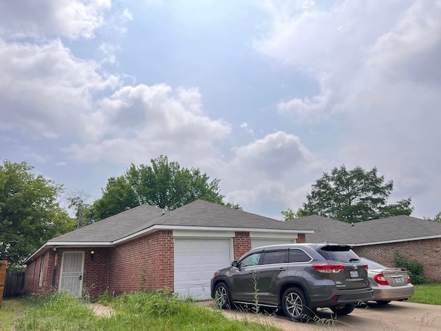 view of side of home featuring a garage