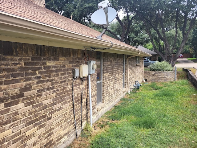 view of property exterior with a yard