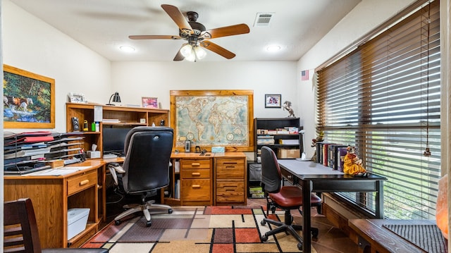 tiled office featuring ceiling fan