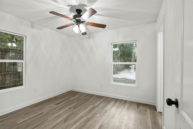 unfurnished room featuring ceiling fan and hardwood / wood-style flooring