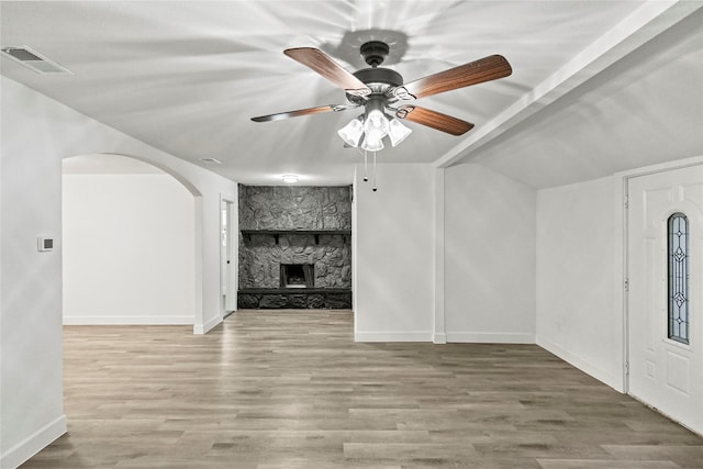 unfurnished living room with a fireplace, light hardwood / wood-style flooring, and ceiling fan