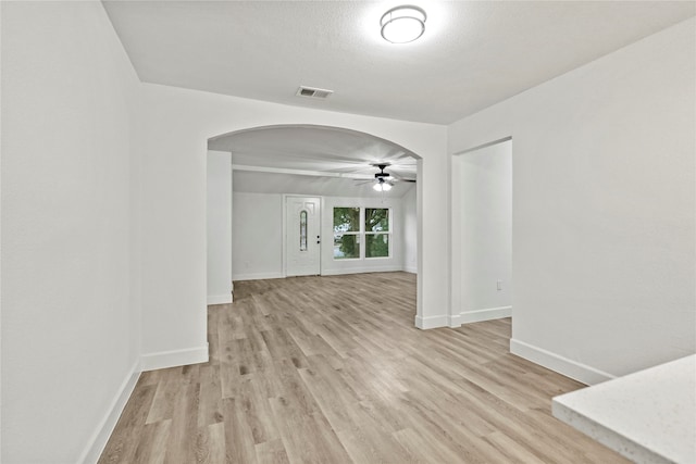 unfurnished room featuring ceiling fan and light hardwood / wood-style floors