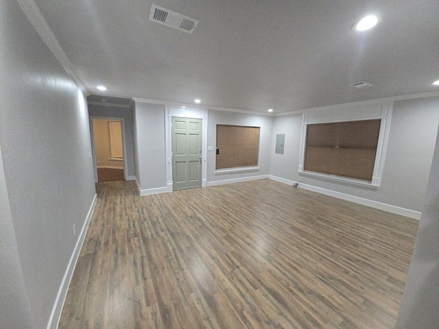 unfurnished living room with a textured ceiling, dark hardwood / wood-style floors, and ornamental molding