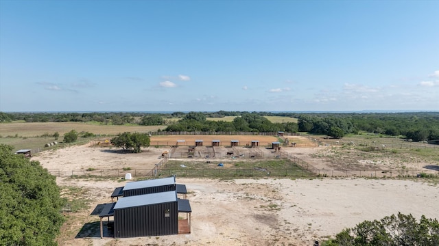 birds eye view of property with a rural view