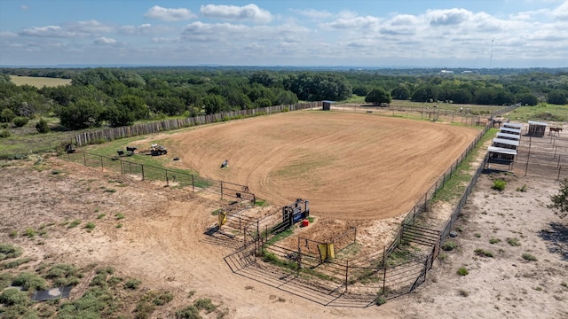 birds eye view of property with a rural view