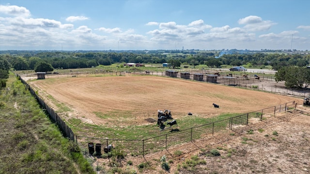 birds eye view of property with a rural view