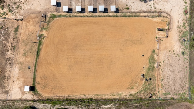 birds eye view of property with a rural view