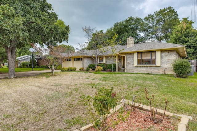 ranch-style house featuring a garage and a front lawn