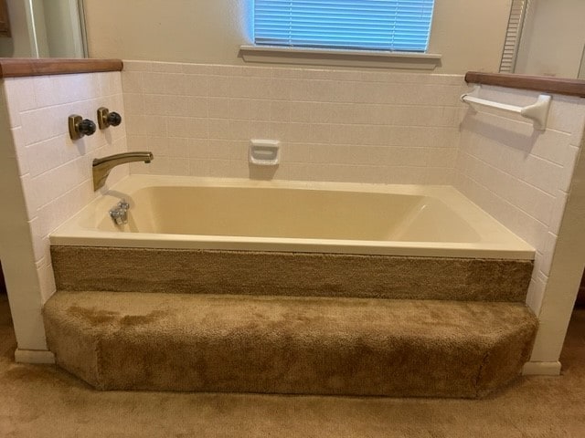 bathroom featuring a tub