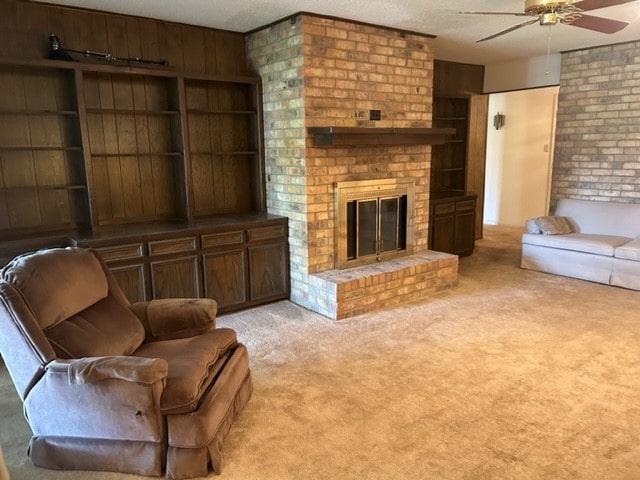 living room with ceiling fan, light carpet, wooden walls, and a fireplace