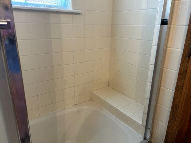 bathroom featuring plus walk in shower