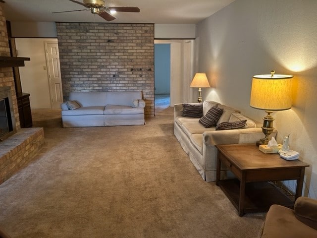 living room featuring ceiling fan, carpet, and a brick fireplace