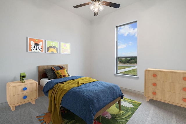 carpeted bedroom with ceiling fan and baseboards