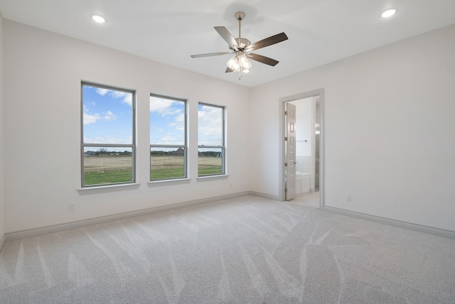 unfurnished room featuring a ceiling fan, recessed lighting, light carpet, and baseboards