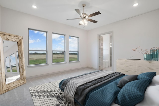 bedroom with recessed lighting, ensuite bathroom, a ceiling fan, light carpet, and baseboards