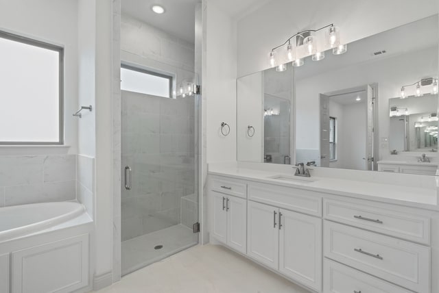 full bath featuring visible vents, a stall shower, a garden tub, and vanity