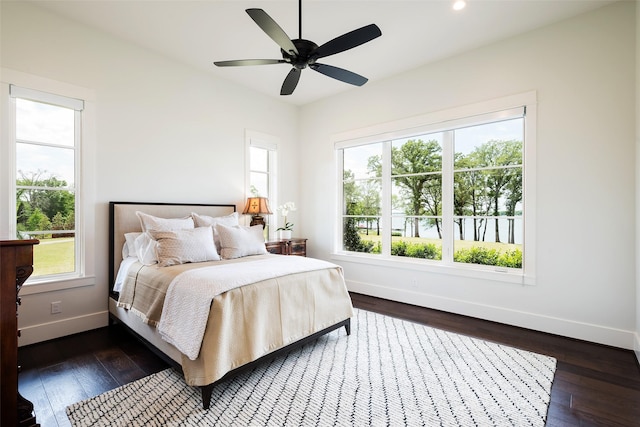 bedroom featuring dark hardwood / wood-style flooring and ceiling fan