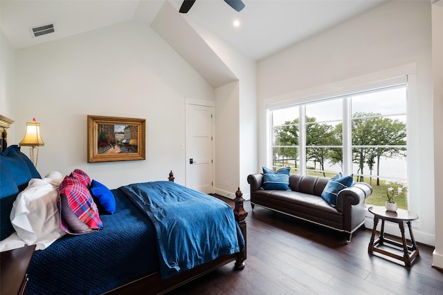 bedroom with dark hardwood / wood-style flooring, high vaulted ceiling, and ceiling fan