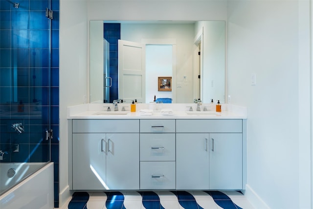 bathroom with vanity, tile patterned flooring, and combined bath / shower with glass door