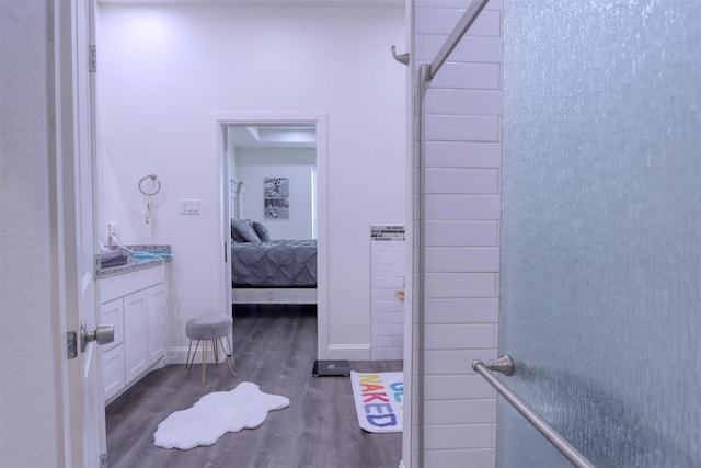 bathroom with vanity and hardwood / wood-style flooring