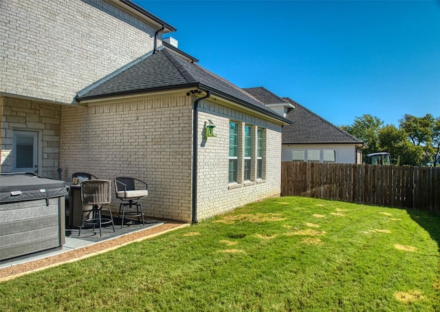 exterior space with a lawn and a patio area