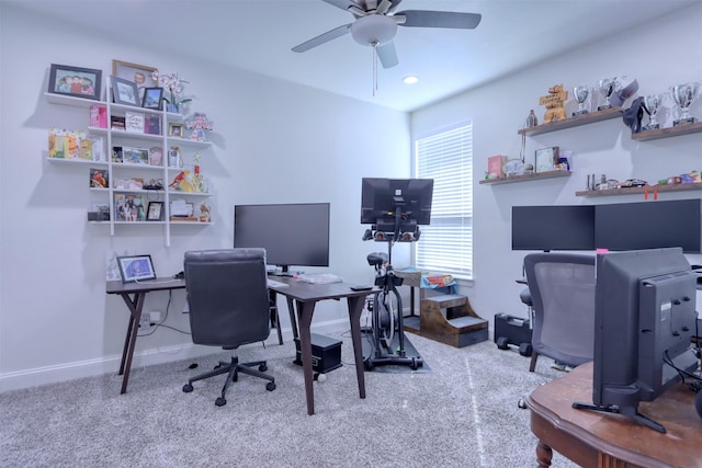 carpeted office with ceiling fan