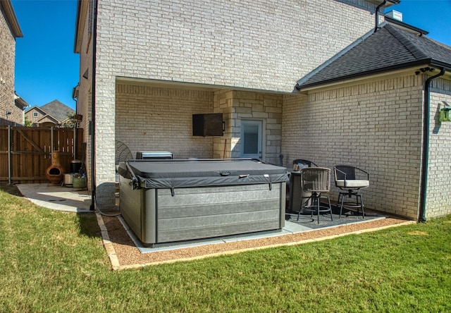 view of patio / terrace featuring a hot tub