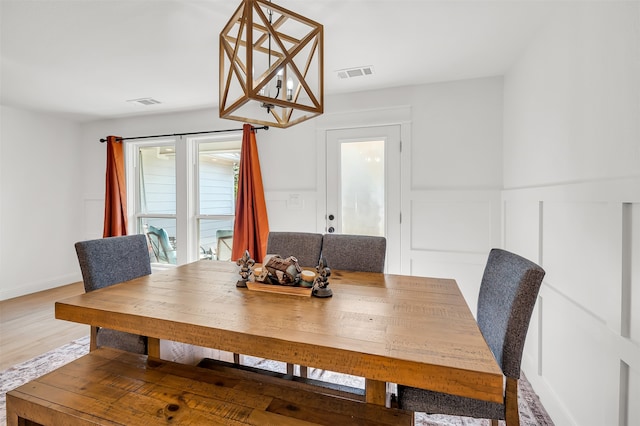 dining room with hardwood / wood-style floors