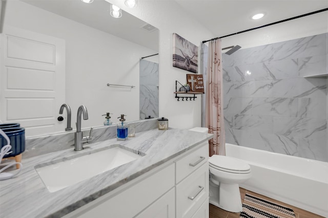 full bathroom with toilet, visible vents, shower / bath combination with curtain, and vanity