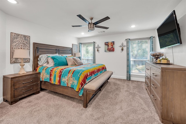 bedroom featuring light colored carpet, recessed lighting, baseboards, and visible vents