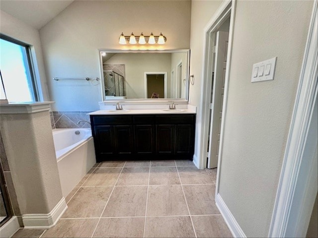 bathroom featuring separate shower and tub, tile patterned floors, vanity, and vaulted ceiling