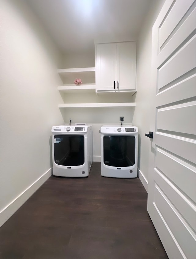 laundry room with dark wood-type flooring, cabinets, and separate washer and dryer