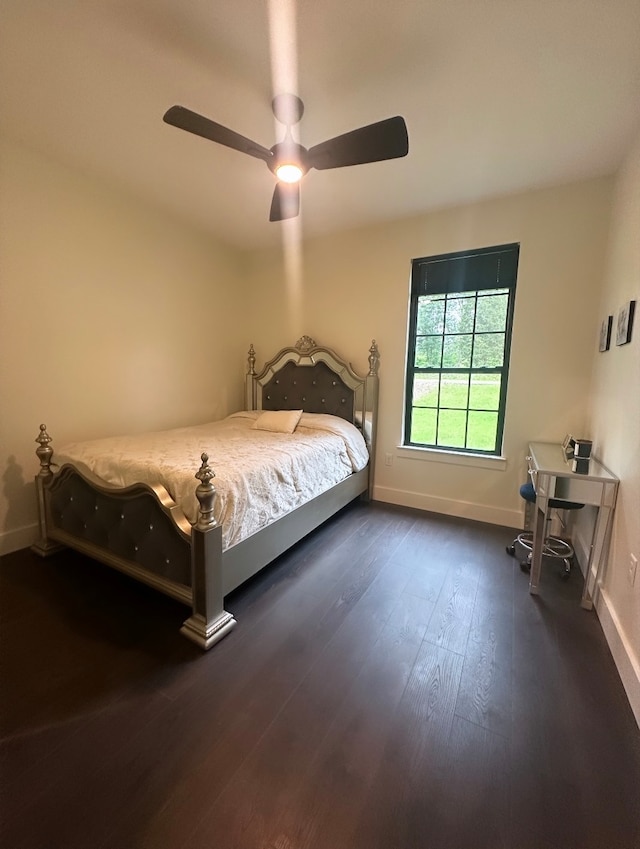 bedroom featuring dark hardwood / wood-style flooring and ceiling fan