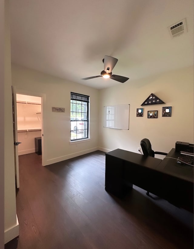 office space with dark wood-type flooring and ceiling fan