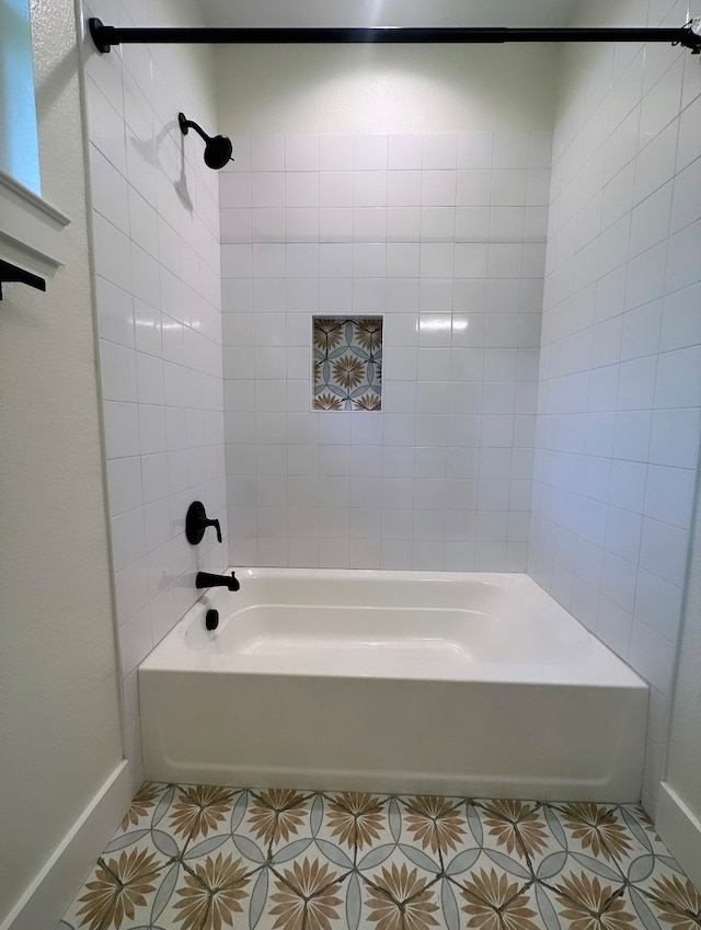 bathroom with tile patterned flooring and tiled shower / bath combo