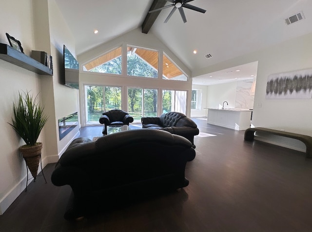 living room with high vaulted ceiling, ceiling fan, beam ceiling, and hardwood / wood-style flooring