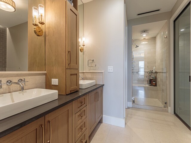 bathroom with vanity, tile patterned floors, and walk in shower